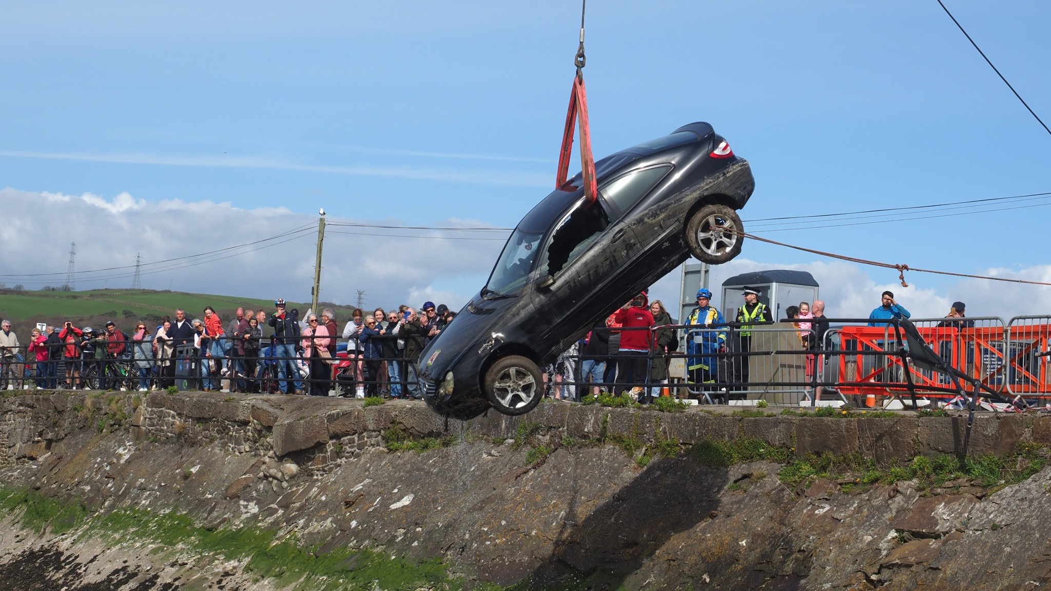 Crowds gather to watch recovery of car from Burry Port Harbour