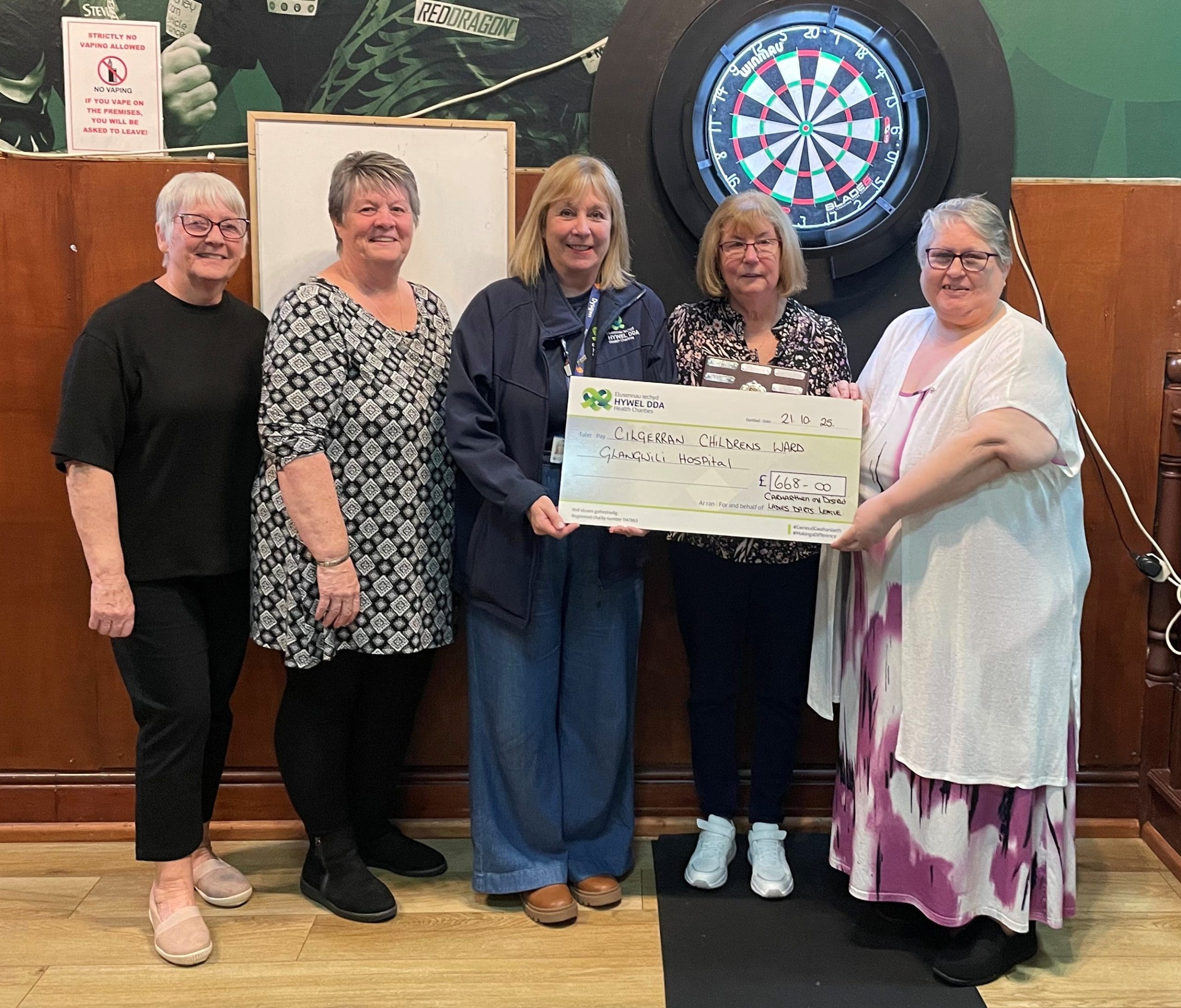 Carmarthen-based darts team raises hundreds of pounds for Hywel Dda Health Charities through raffle evening